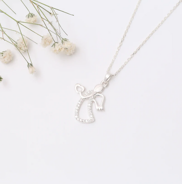 Enchant your outfit with the ethereal elegance of the Angel Heart necklace